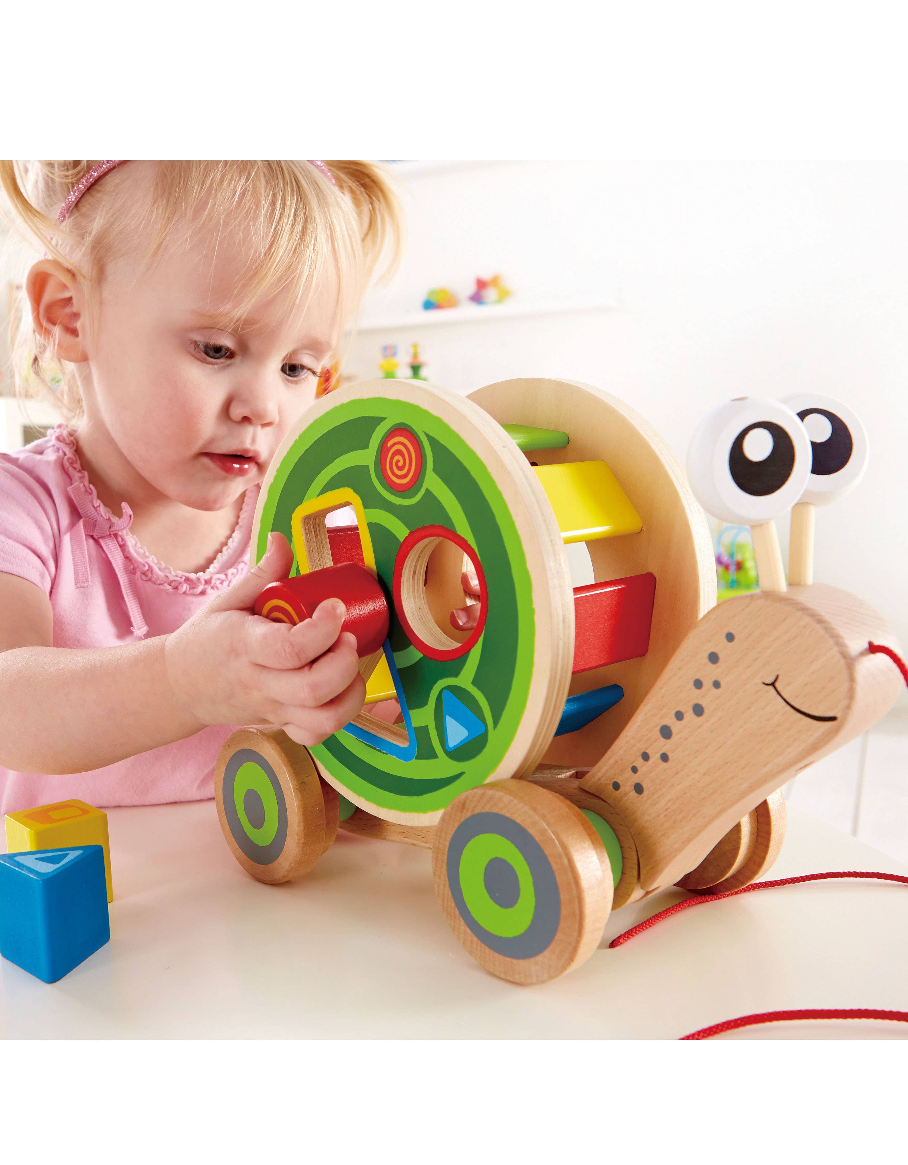 Hape Toys - Hape Walk-A-Long Snail - Pull-Along Toy with Shape Sorting.