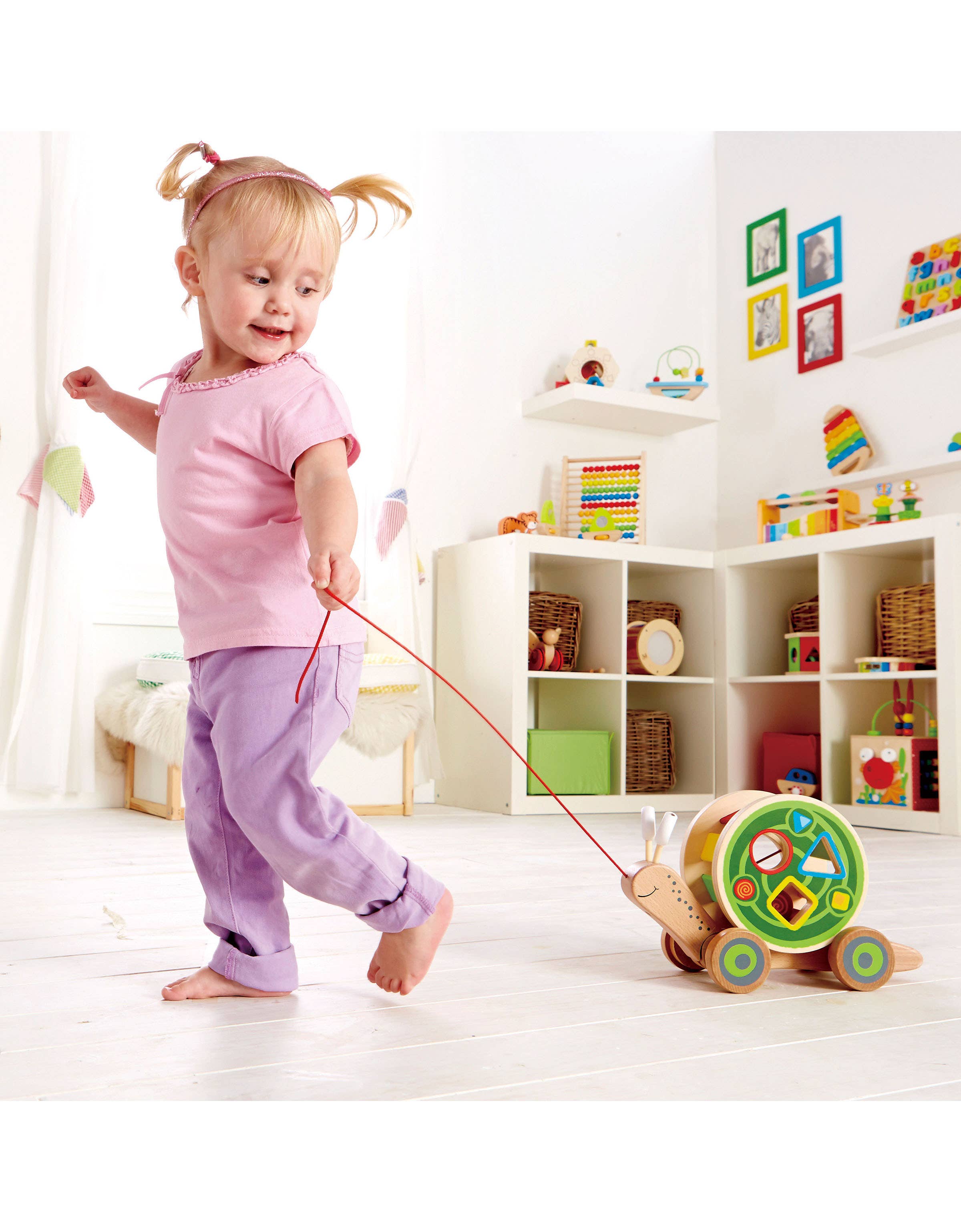 Hape Toys - Hape Walk-A-Long Snail - Pull-Along Toy with Shape Sorting.