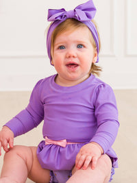 RuffleButts + RuggedButts - Girls Amethyst Princess Long Sleeve Bow Skirted One Piece Swimsuit