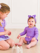 RuffleButts + RuggedButts - Girls Amethyst Princess Long Sleeve Bow Skirted One Piece Swimsuit