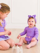 RuffleButts + RuggedButts - Girls Amethyst Princess Long Sleeve Bow Skirted One Piece Swimsuit - Little Stars Toy Store & PlayhouseRuffleButts + RuggedButts